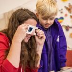 Home-Start East Lothian volunteer and child playing with mask