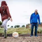 Playing football on the beach East Lothian