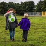 Child and volunteer in park East Lothian